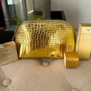 Cle de peau travel size with beautiful gold make up bag.